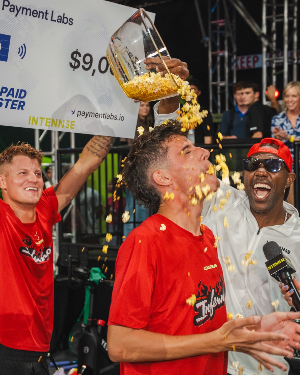 Terrell Owens laughing as popcorn is poured over an Inferno player after a win
